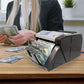 Business owner using Nadex V1800 bill counter for cash handling at shift end
