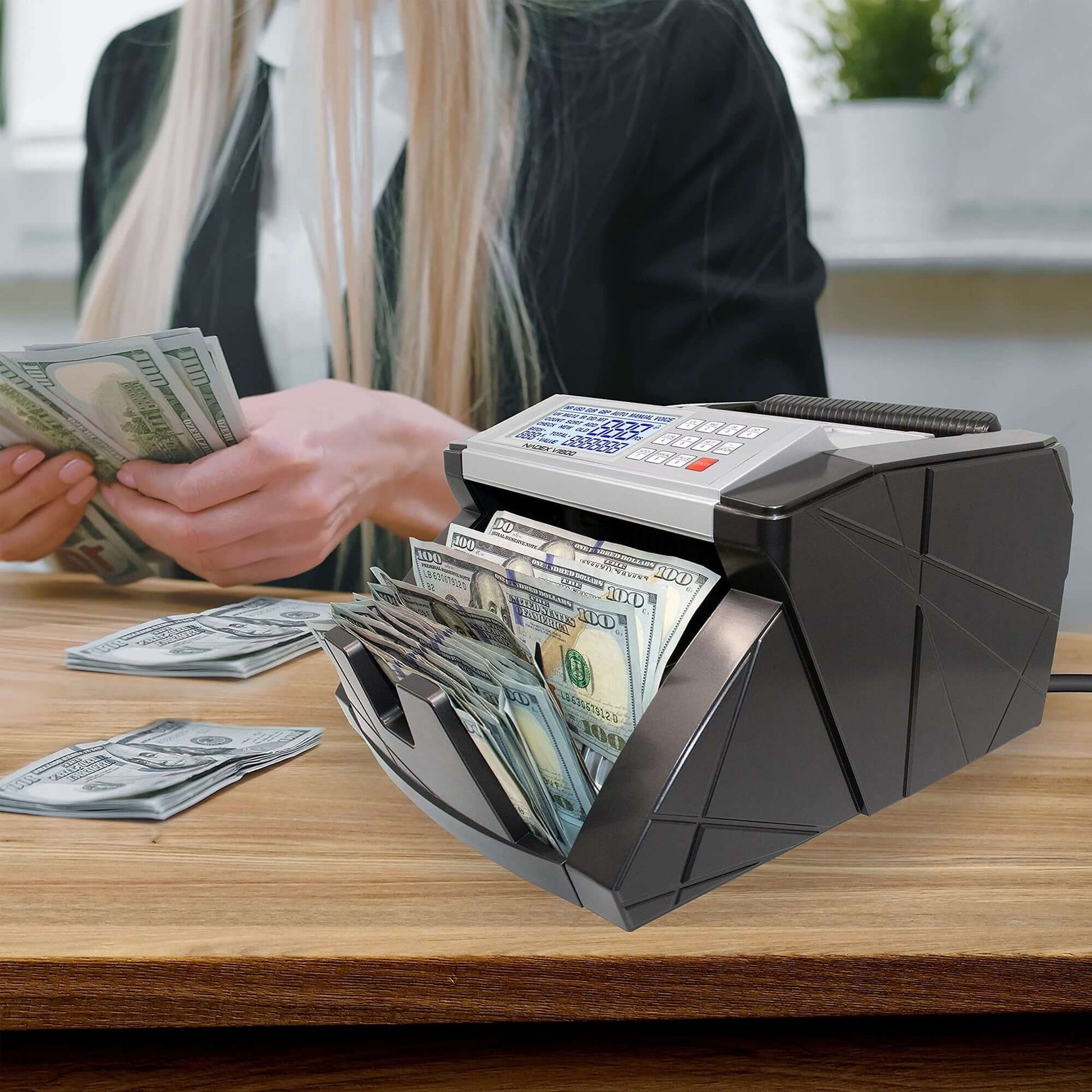Business owner using Nadex V1800 bill counter for cash handling at shift end